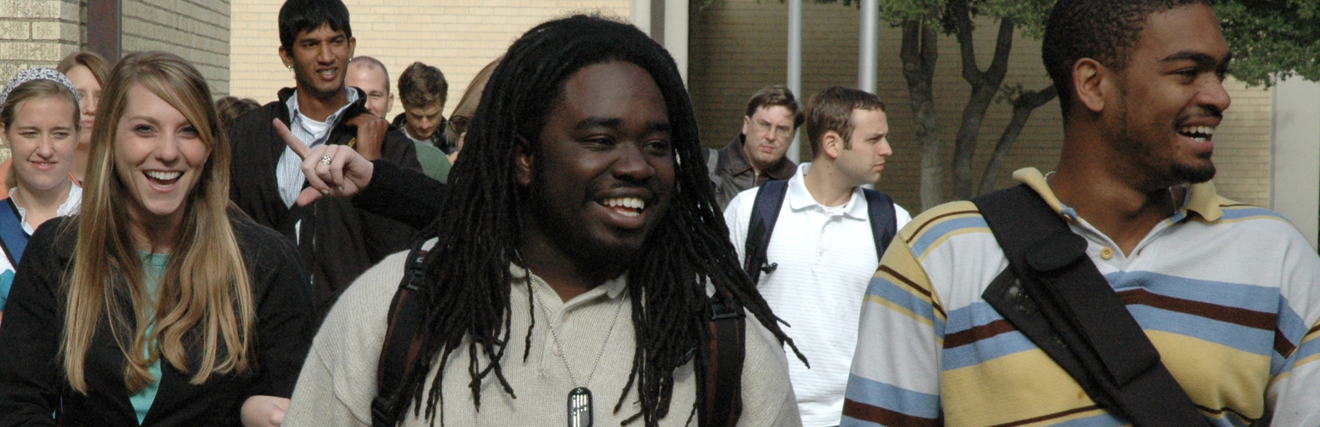 people walking across campus