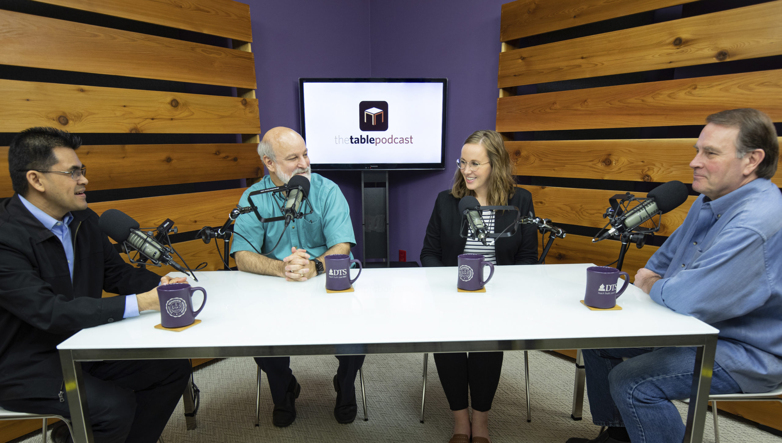 four people recording the Table Podcast